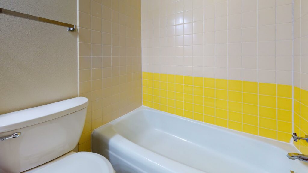bathroom with yellow tiles
